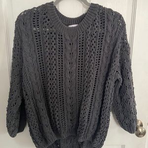 Charcoal gray sweater.
